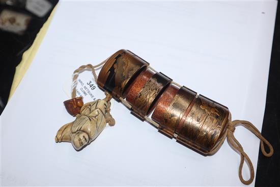 A 19th century Japanese gold lacquer five case inro, signed, together with an 18th/19th century ivory netsuke and a ojime